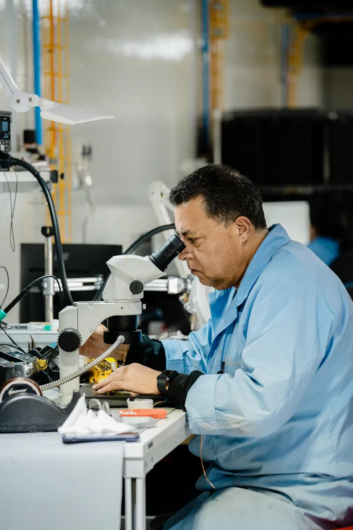 Engineer working at a microscope