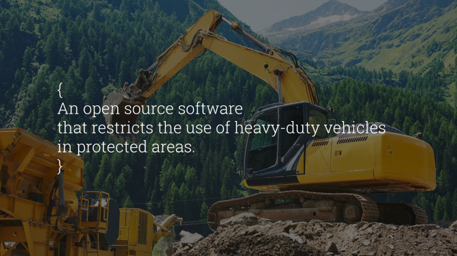 Yellow excavator on rocky ground with overlay text about open-source software restricting heavy-duty vehicles