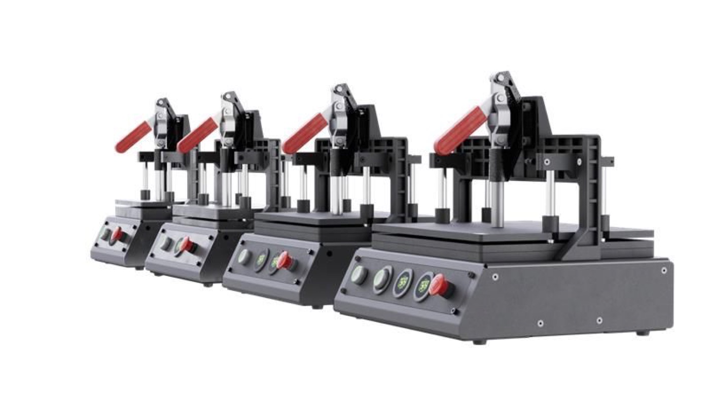 Four 3D printed PCB test fixtures in a row, each with a red-handled toggle clamp and front-panel buttons with an e-stop