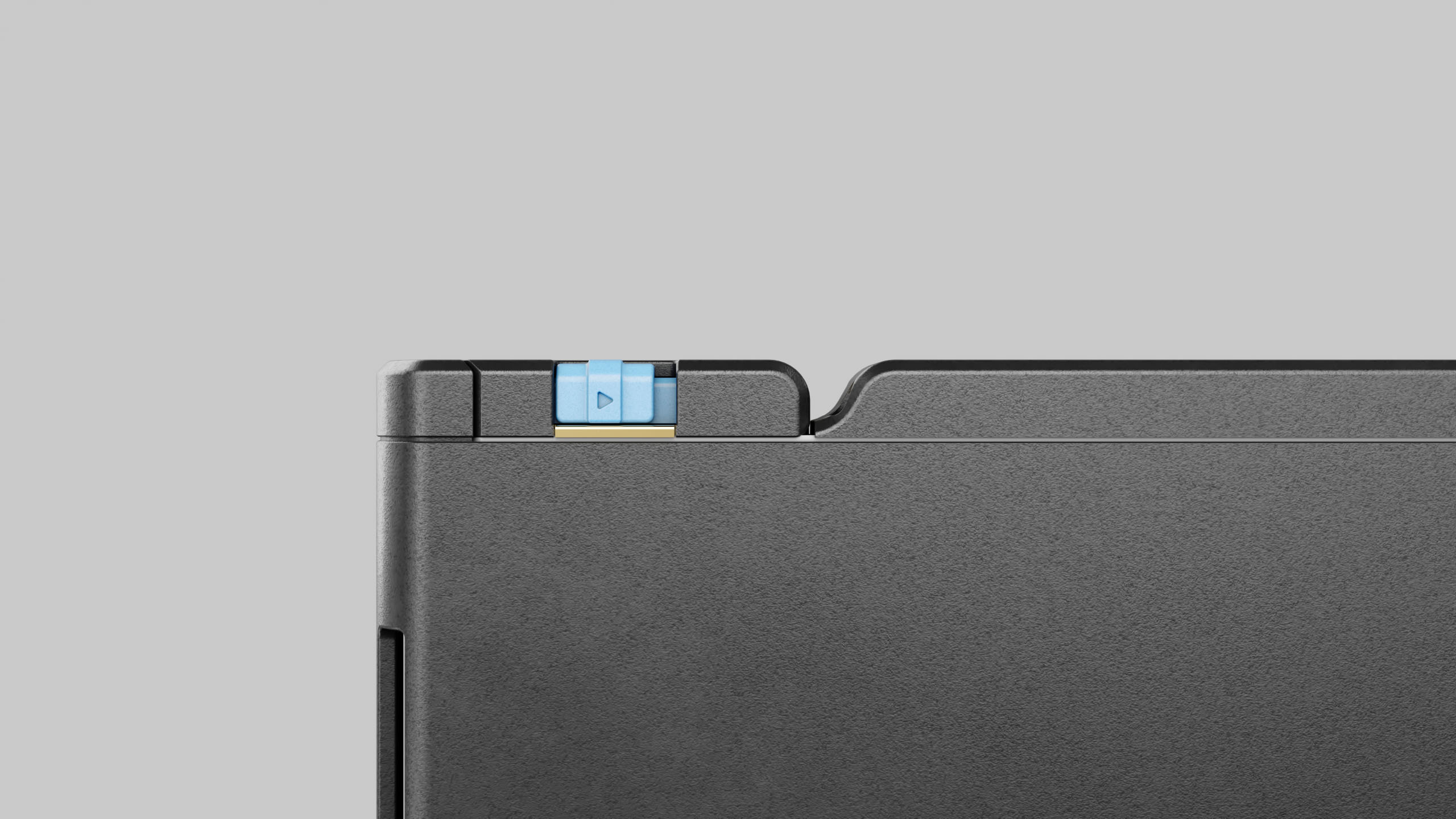 Close detail of the control unit housing, with a pale blue sliding control marked by a triangular glyph on a brass rail