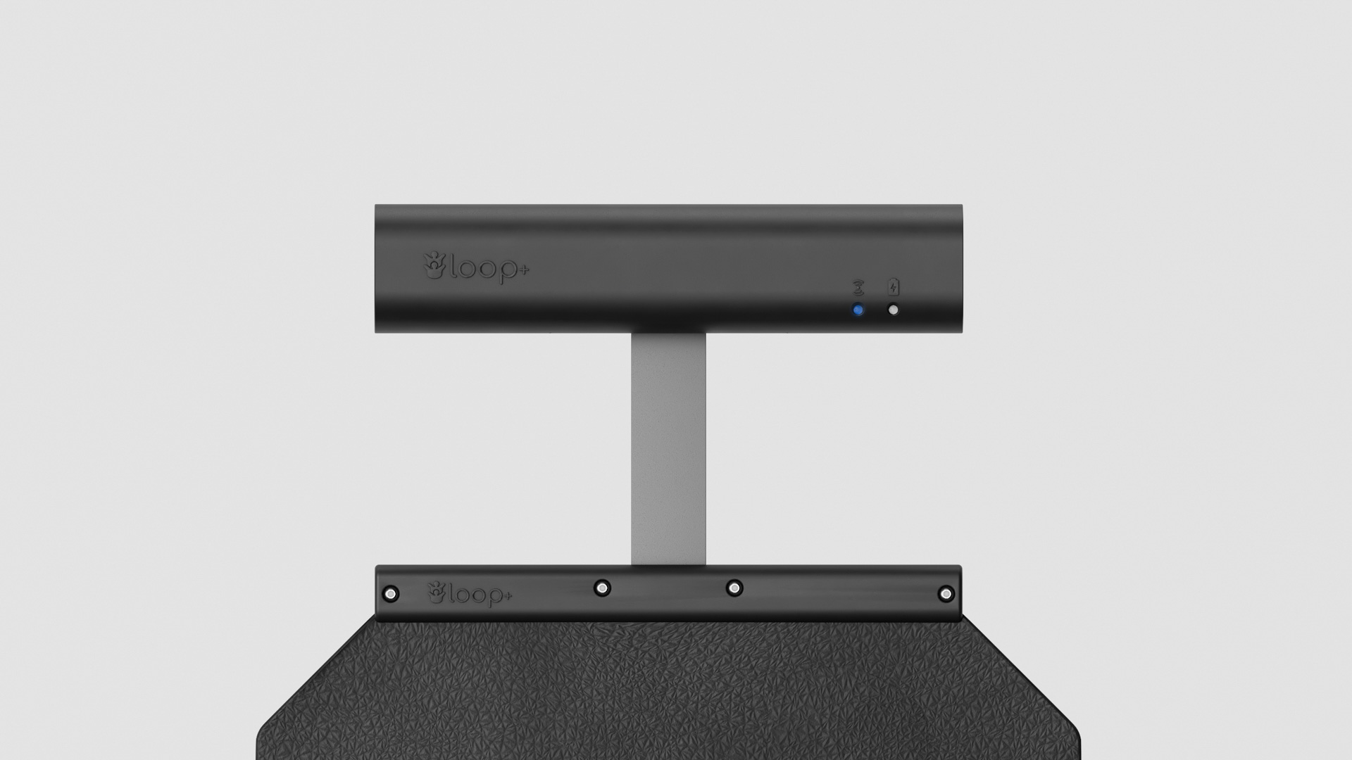 The loop+ control unit on its grey stem above the screwed mounting rail that clamps the top edge of the black sensor mat