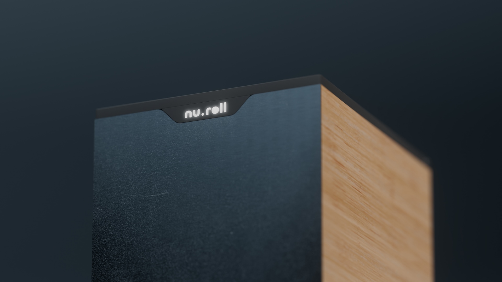 Top corner of the NuRoll storage unit, brushed metal front and bamboo side, with an illuminated nu.roll logo
