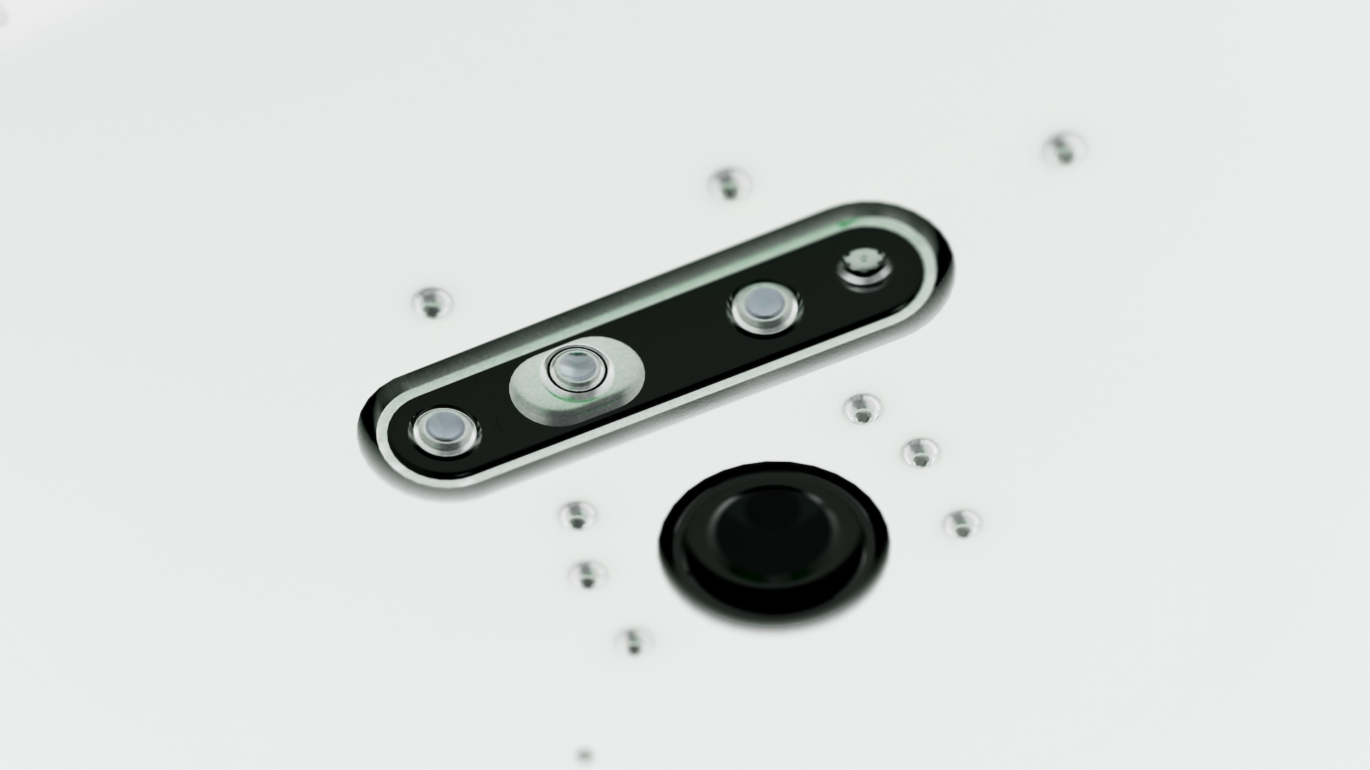 Close-up of the rig's recessed black camera module with three lenses, beside a round black dome set into the white panel